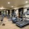 fitness center with large open spaces allowing room for workouts and for using equipment