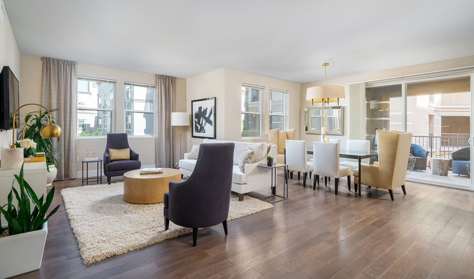 Sunlight, Meet Spacious living room and connected dining area with wood-style flooring